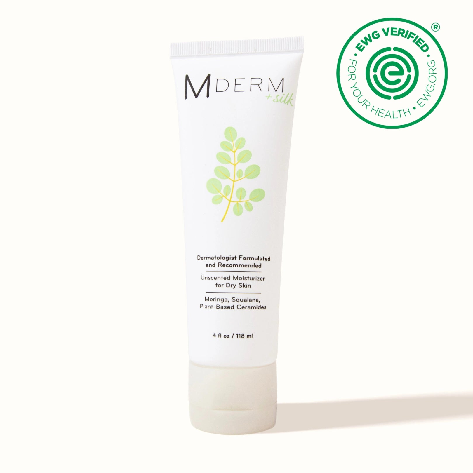 A photo of a single MDERM +silk tube, 4 fl oz / 118 ml. Label reads: dermatologist formulated and recommended, unscented moisturizer for dry skin, with moringa, squalane, and plant-based ceramides. EWG Verified seal.