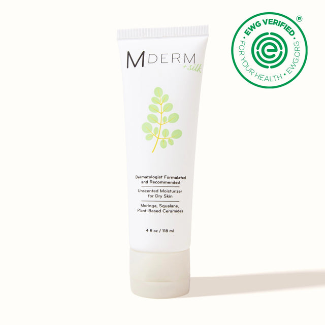 A photo of a single MDERM +silk tube, 4 fl oz / 118 ml. Label reads: dermatologist formulated and recommended, unscented moisturizer for dry skin, with moringa, squalane, and plant-based ceramides. EWG Verified seal.